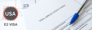 E2 visa application form ready for submission with a pen.