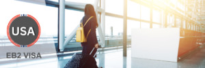 Professional woman traveling with luggage, representing EB2 visa holders' travel.